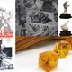 Clockwise from left: Metal Gear Solid: The Board Game, Weird Tales Presents: Pandemonium Noir, Trivial Pursuit: Horror Ultimate Edition, and Mosquito in Amber RPG Dice.
